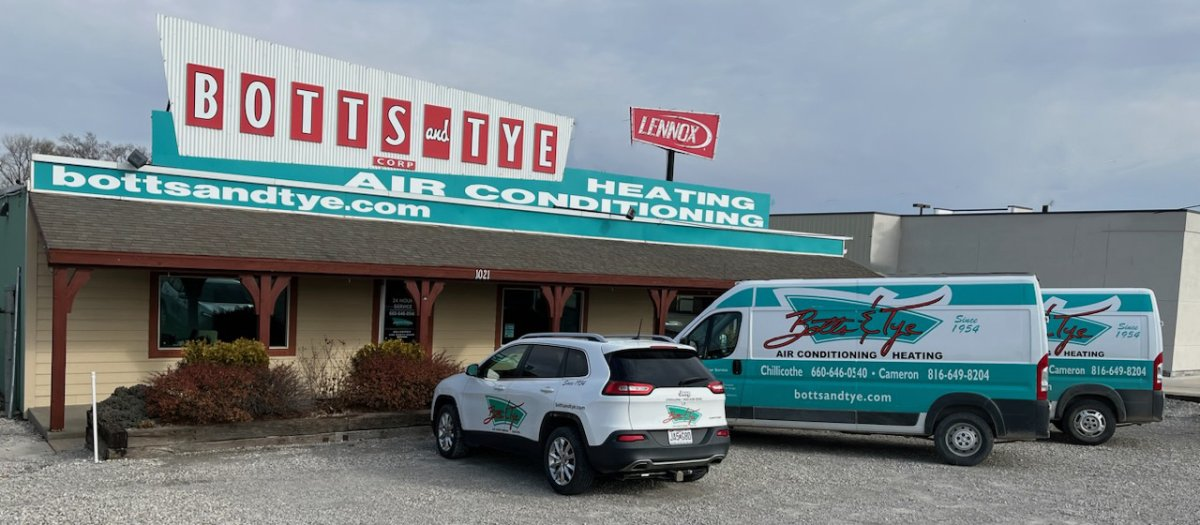 Botts & Tye vehicles parked in front of the shop